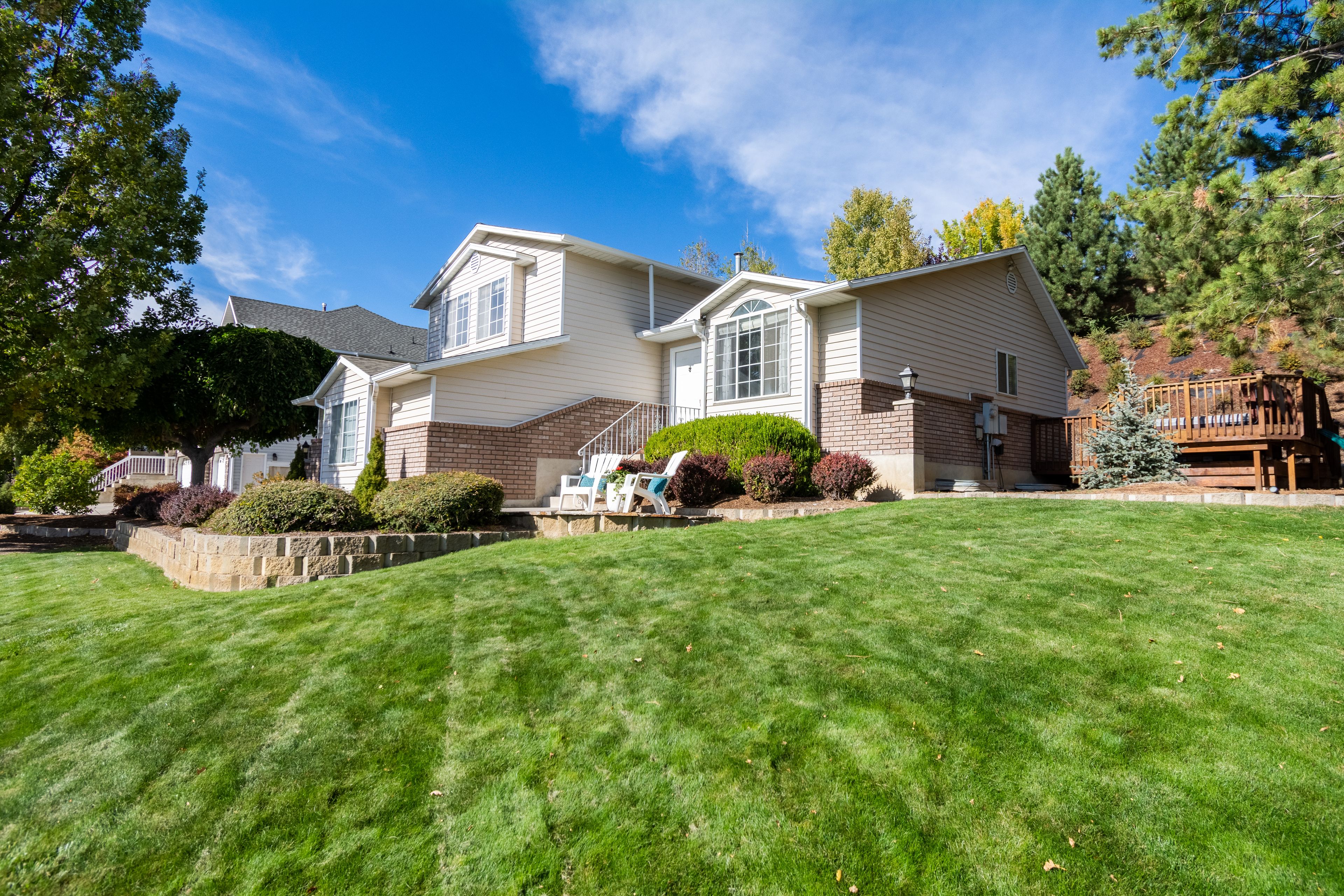 Manicured lawn and landscaping in front of a home
